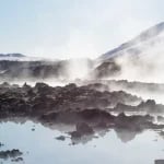 iceland hot springs white clouds over lake during daytime
