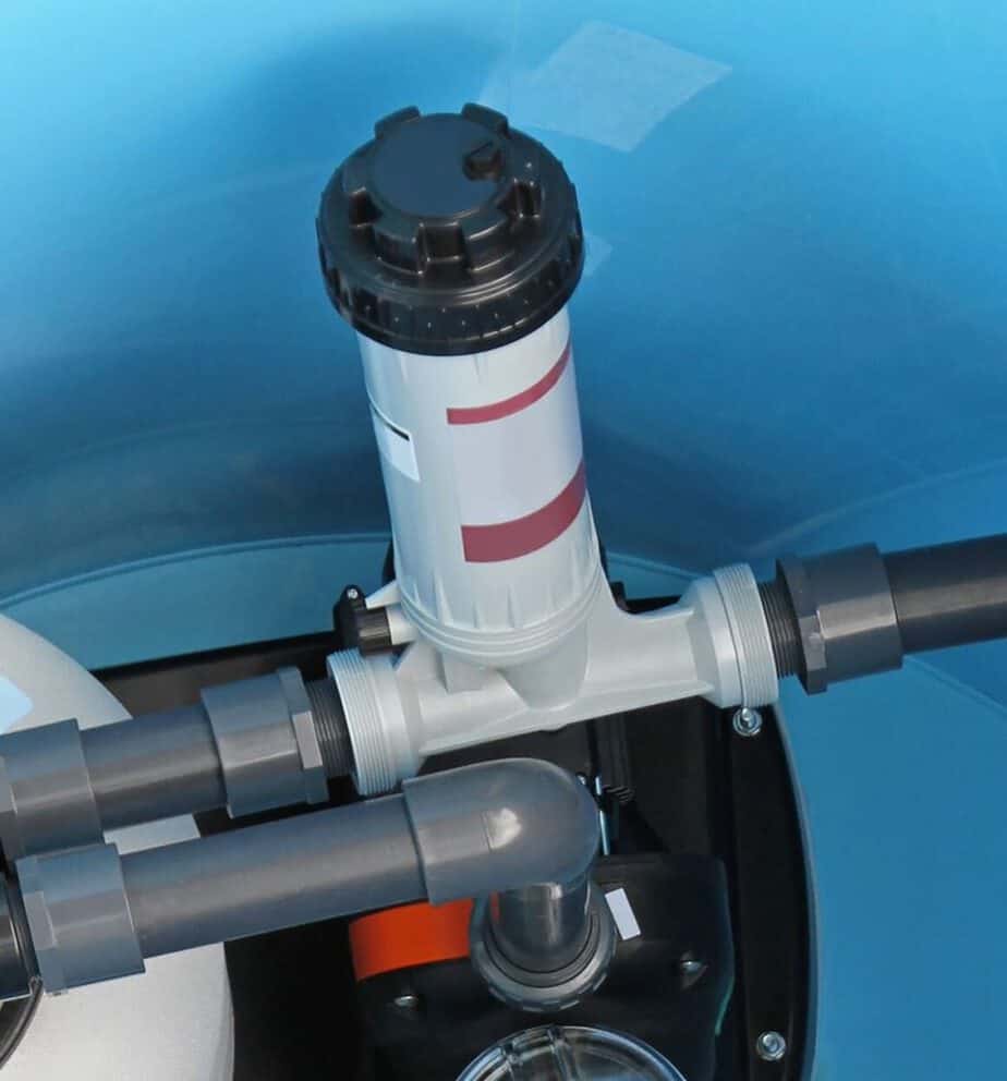 An inline chlorinator hooked to a pool pluming system.