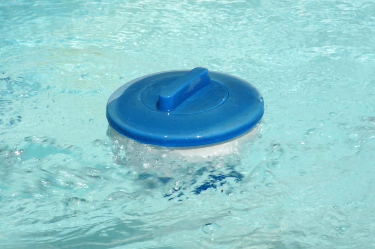 A floating chlorinator in the water.