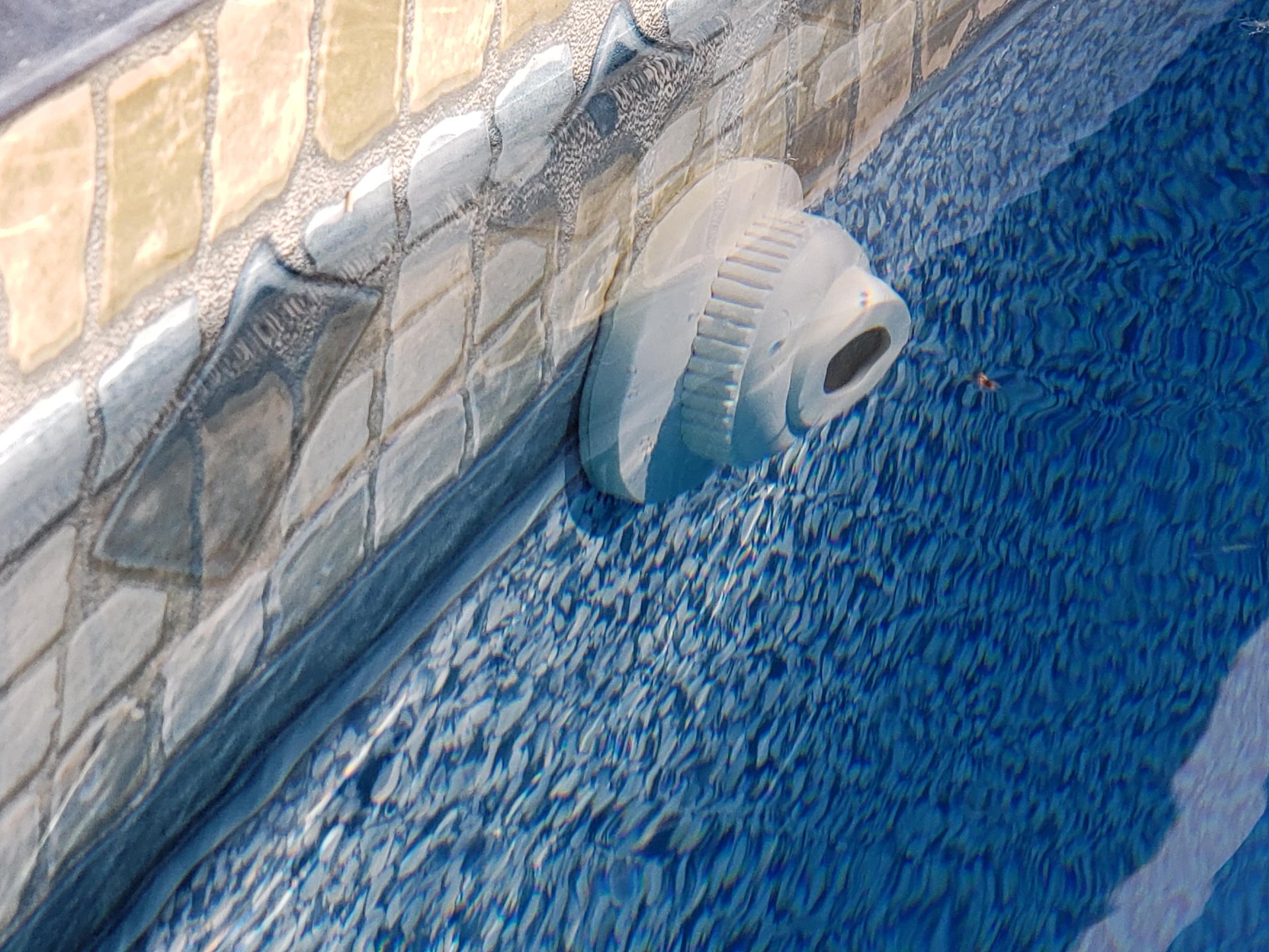 The pool return at the liner of the pool.