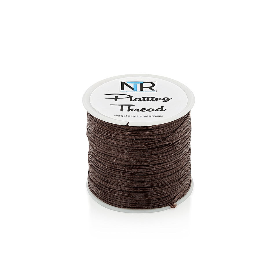 A spool of NTR Plaiting Thread on a white background.