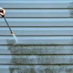 Professional house washing services to enhance curb appeal and eliminate stains caused by algae, moss, and other residues
