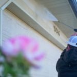 Professional house washing services to enhance curb appeal and eliminate stains caused by algae, moss, and other residues