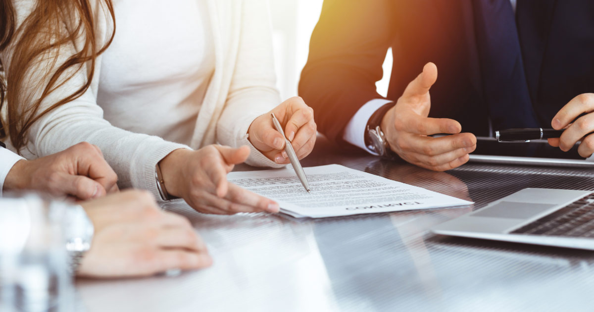 Legal agreement being signed by lawyer and client