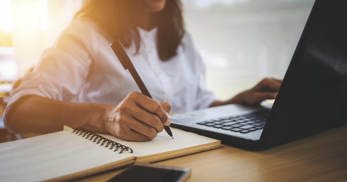 Woman performing background search on her laptop