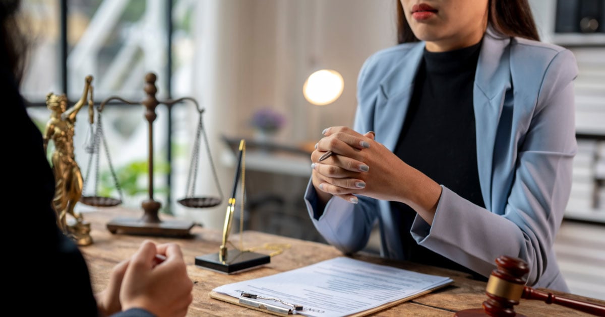 Woman meeting with a lawyer to pursue spousal support