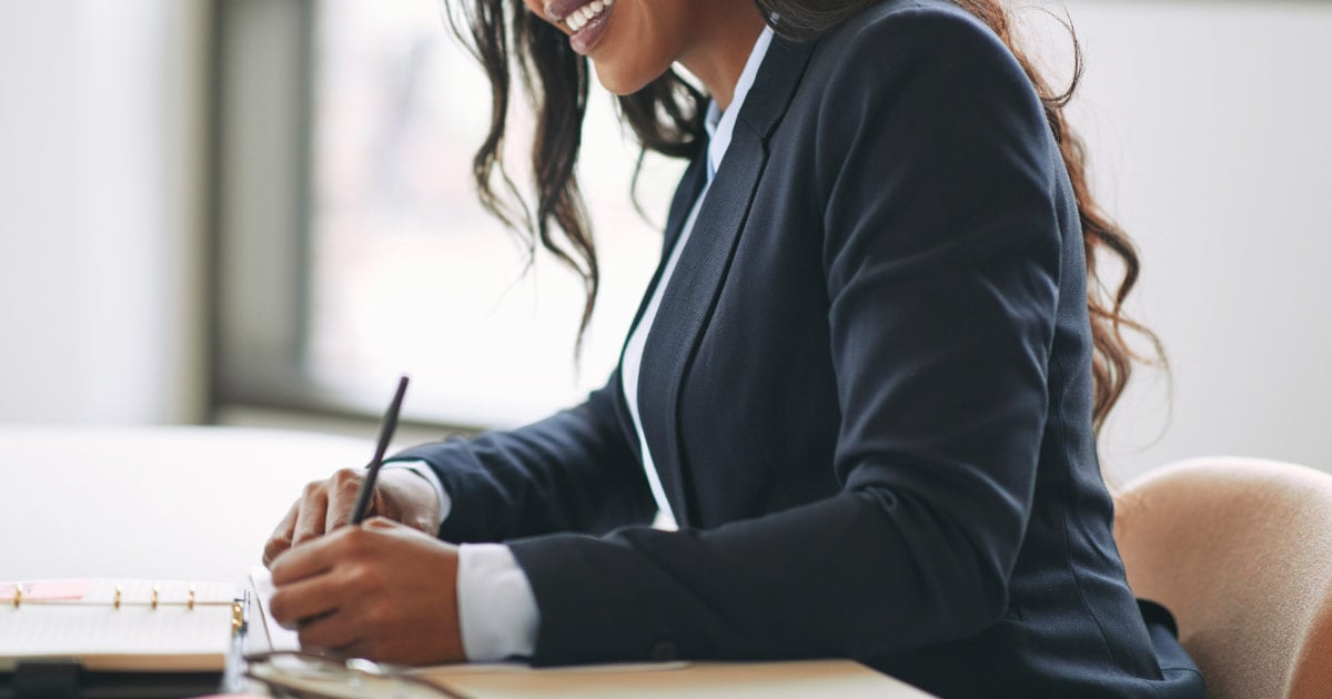 Lawyer completing paperwork on behalf of client