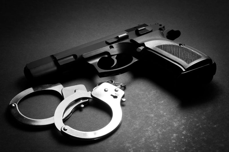 handgun-with-handcuffs-2021-08-26-15-36-39-utc Handgun & Handcuffs