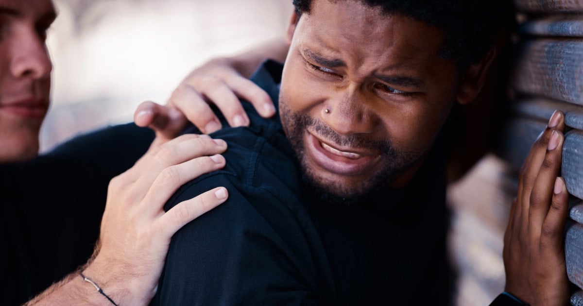 Man being placed under arrest for drug possession