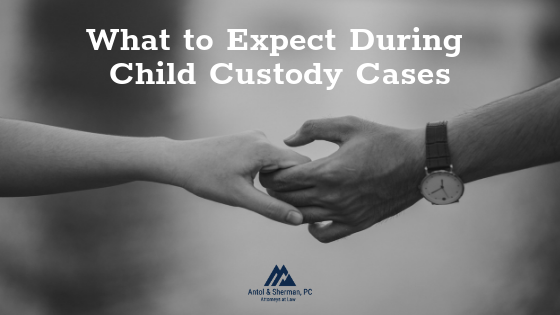 Black and white image of a man and woman releasing a hand hold.