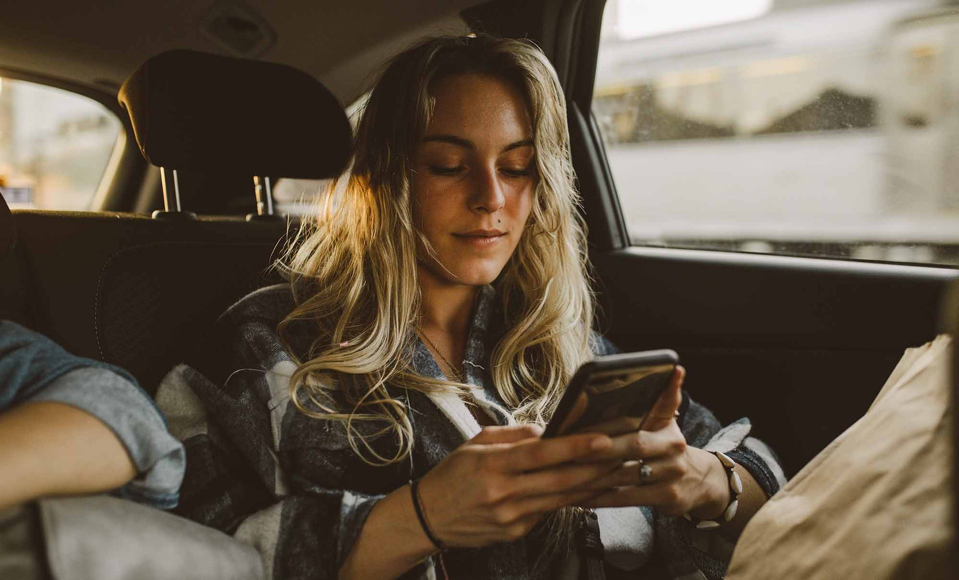 Girl in car texting