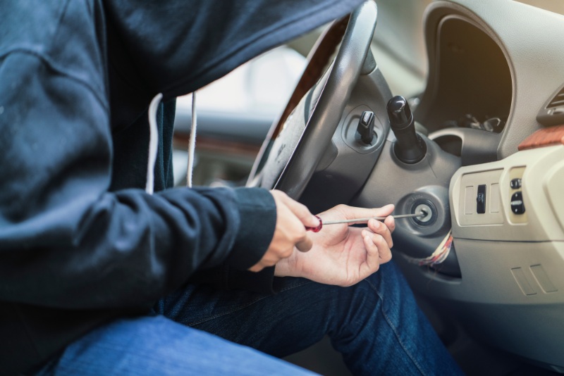 person stealing a car