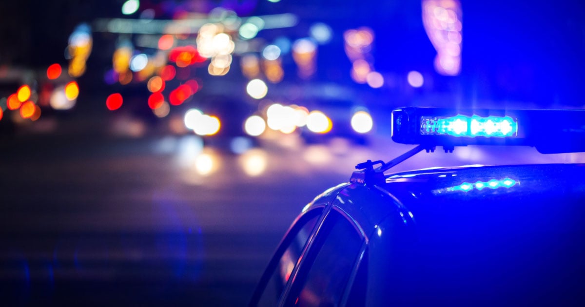 Police car at night time with lights on