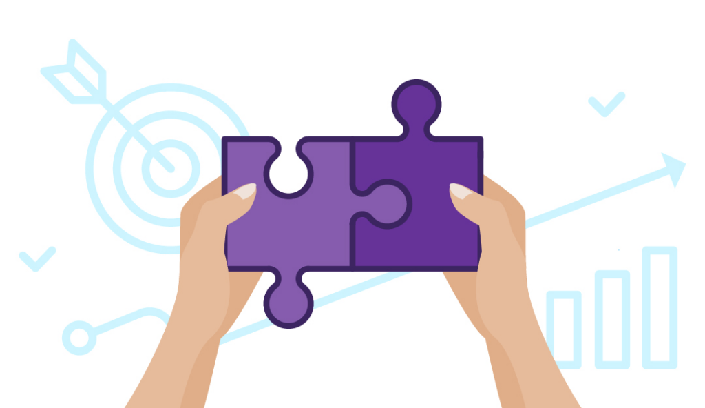 How to Convert Blog Traffic to Sales 3 Hand holding two puzzle pieces and putting it together.