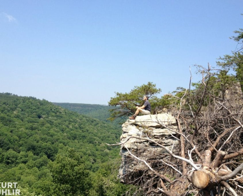 Kurt Uhlir sitting on cliff at Bucks Pocket State Park in Alabam Kurt Uhlir sitting on cliff at Bucks Pocket State Park in Alabama