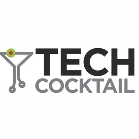 Logo for "TECH COCKTAIL" featuring bold black and gray text. To the left, a martini glass formed from circuit board lines symbolizes healthy communications—central to success—with a green and red olive garnish at the top. White background.
