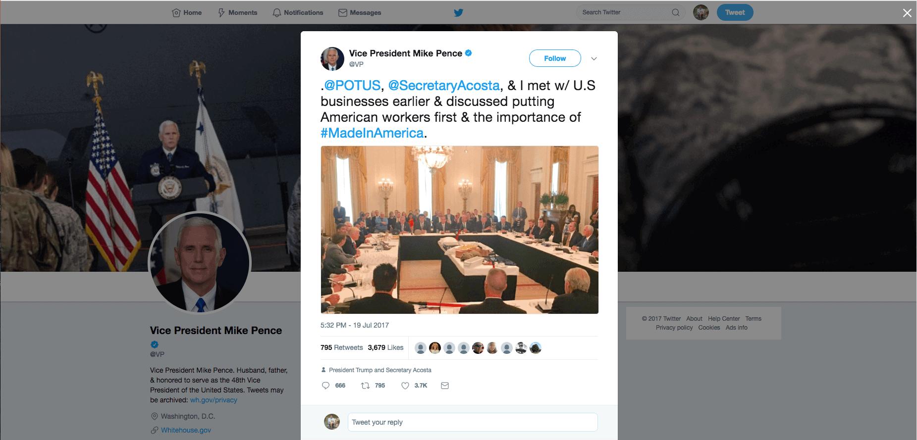 Vice President Mike Pence Tweet - Made in America Roundtable - Margarita Mendoza and Kurt Uhlir 14a A computer screen displays Vice President Mike Pence’s Twitter account. His tweet shows a photo from the Made in America Roundtable, featuring officials and business leaders seated around a long conference table in a grand room with chandeliers and U.S. flags.