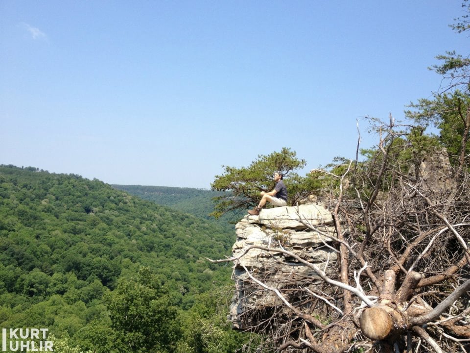 Kurt Uhlir sitting on cliff at Bucks Pocket State Park in Alabam Kurt Uhlir sitting on cliff at Bucks Pocket State Park in Alabama