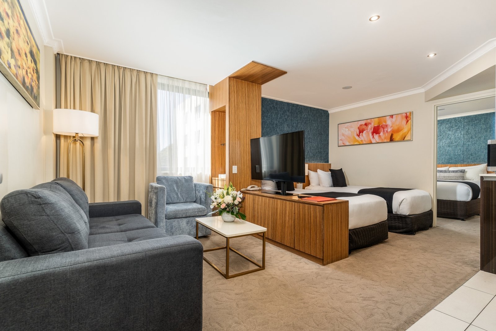 Family Suite at Hotel Diana Woollongabba featuring separate bedroom and open plan living, kitchen and bedroom area