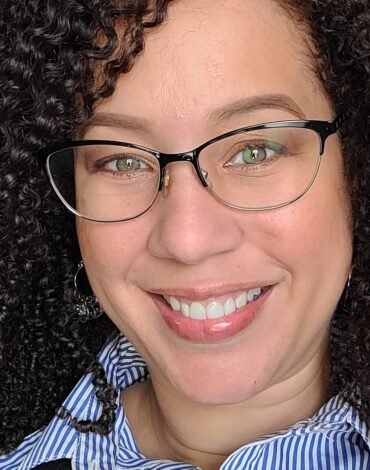 Torri Fisher Picture of African American woman with glasses, smiling.