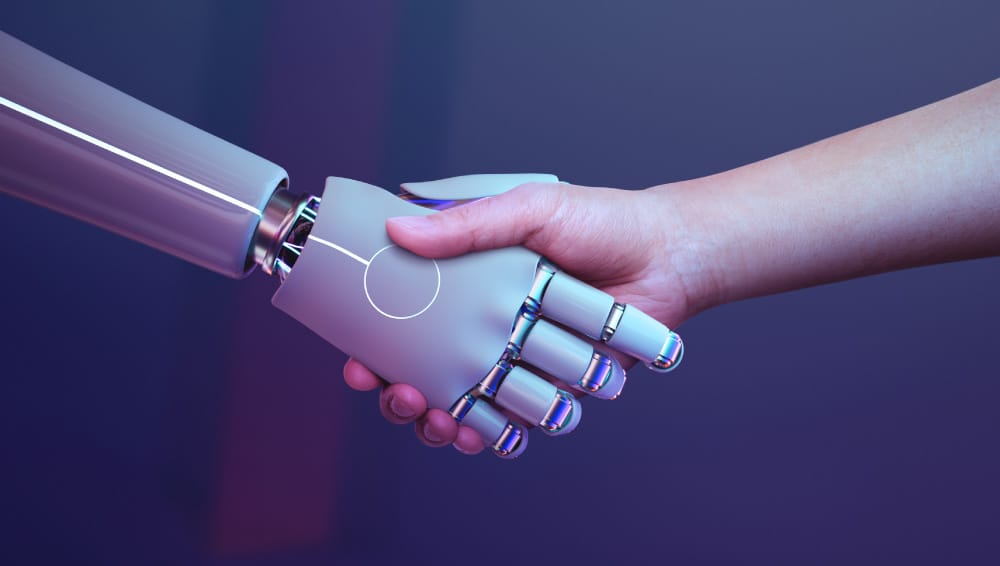 An automation handshake between a robot and a human. An automation handshake between a robot and a human.
