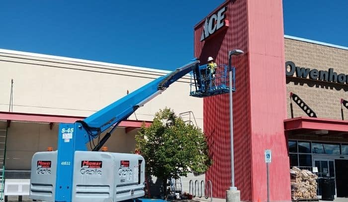 Owenhouse Bozeman Montana_Tower Paint Project_1_ crane being used for owenhouse ace hardware west tower paint project