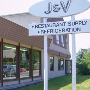 J&V restaruant supply road sign