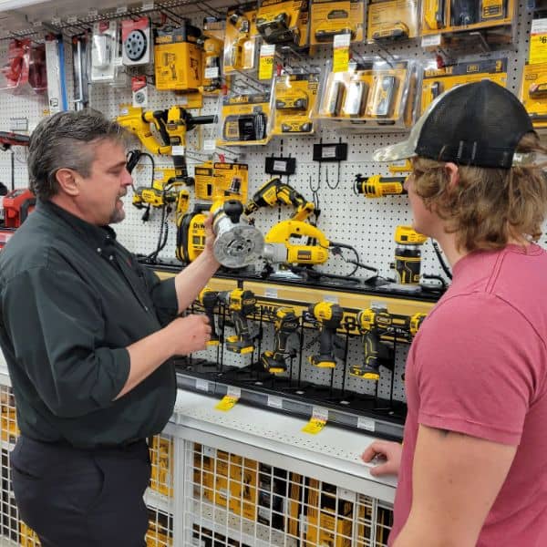 Ace Employee Showing Power Tools to Customer