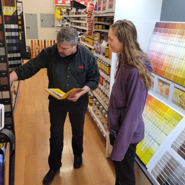Ace Employee Showing Paint Swatches to Customer
