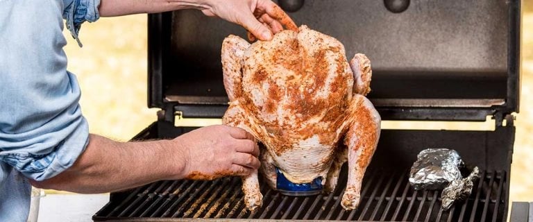 preparing beer can turkey on a grill