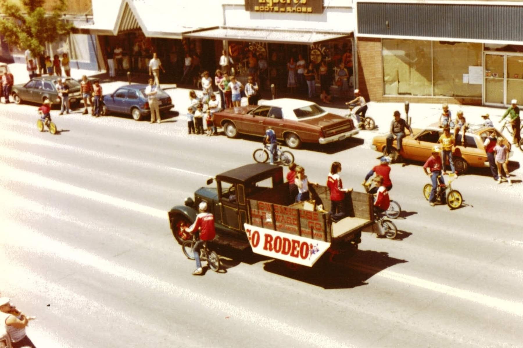 old truck driving down street