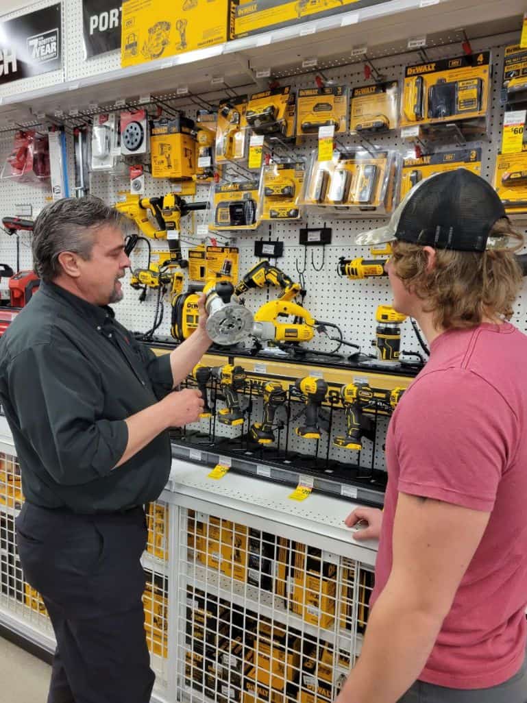 Ace Employee Showing Power Tools to Customer