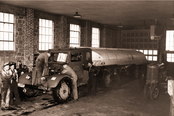 Old Photo Taken of Owenhouse Repair Team Working on 1930s Fuel Truck