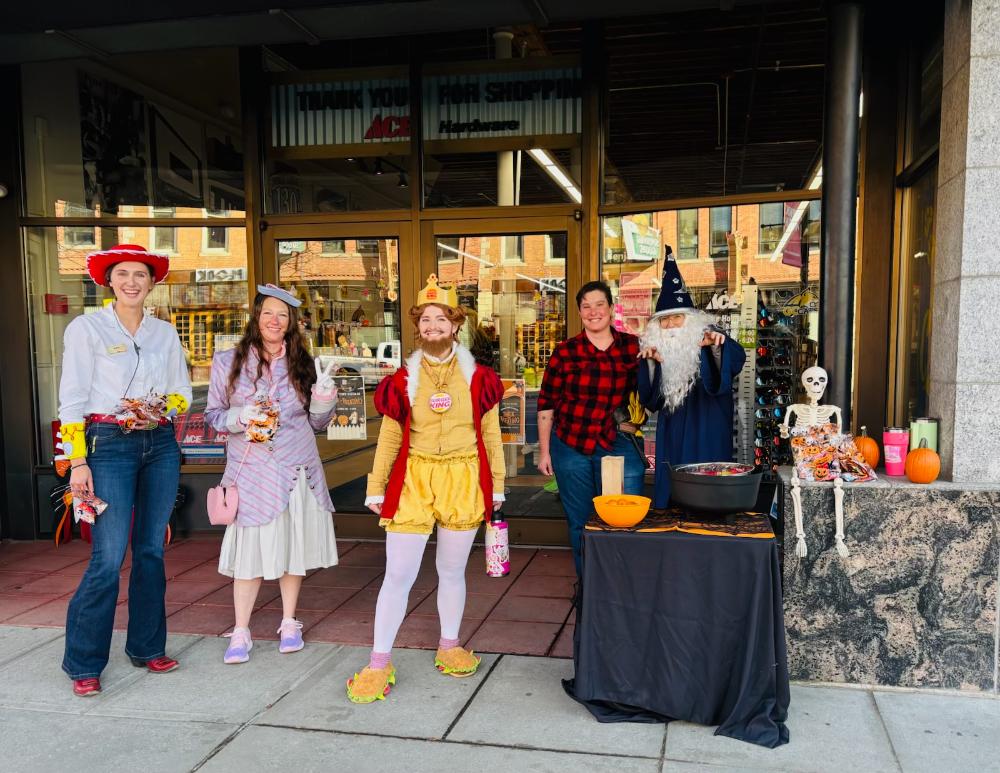 owenhouse ace hardware team dressed up for trick or treating at downtown bozeman
