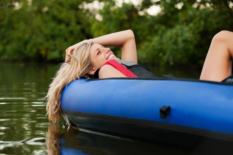 woman relaxing in kayak