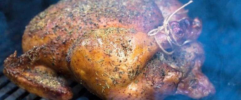 turkey roasting on a grill
