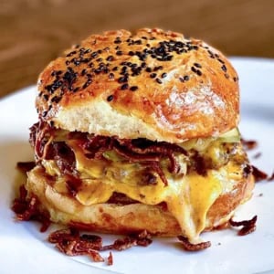 bacon cheeseburger with poppy seed bun