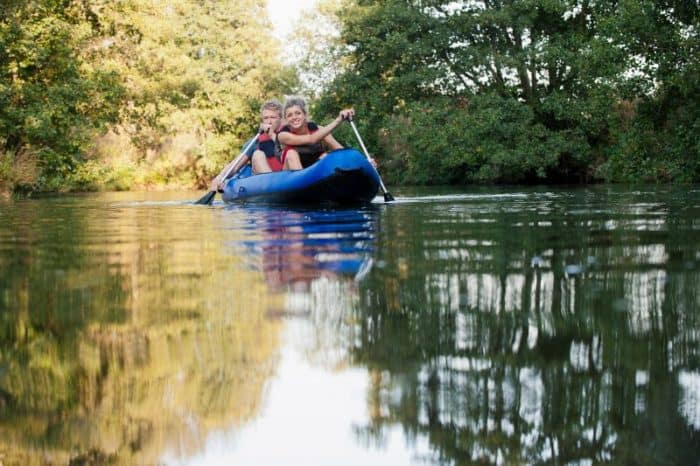smiling couple kayaking