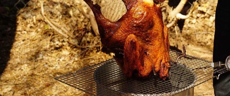 turkey cooling on a rack after being deep fried