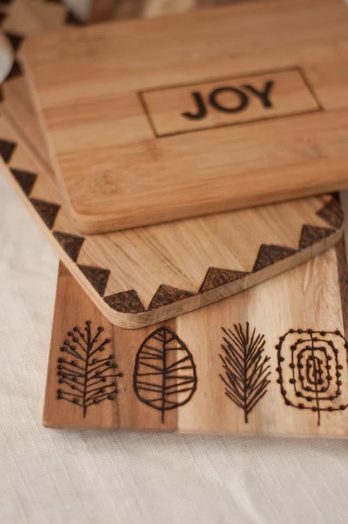 DIY Etched Cutting Board with Joy and leaves etched into it