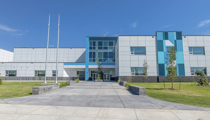O’brian Lake School a building with a clock on the side of a road