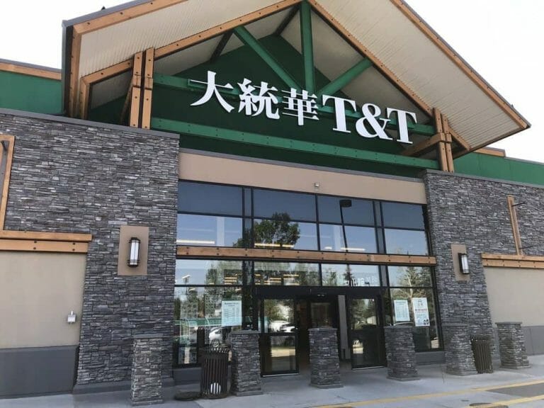 a sign above a store in a brick building
