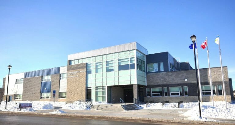a building with snow on the ground