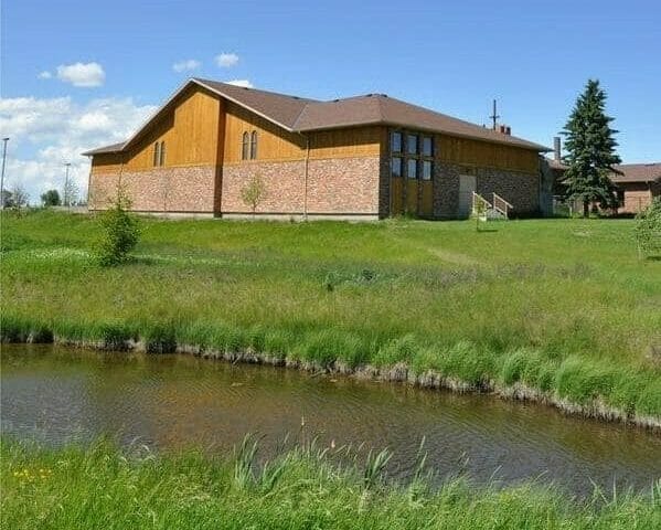 a small house in a body of water
