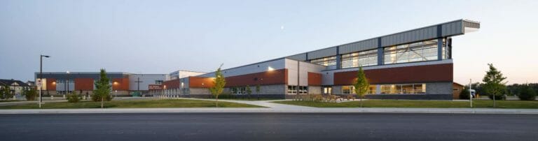 a large empty parking lot in front of a building