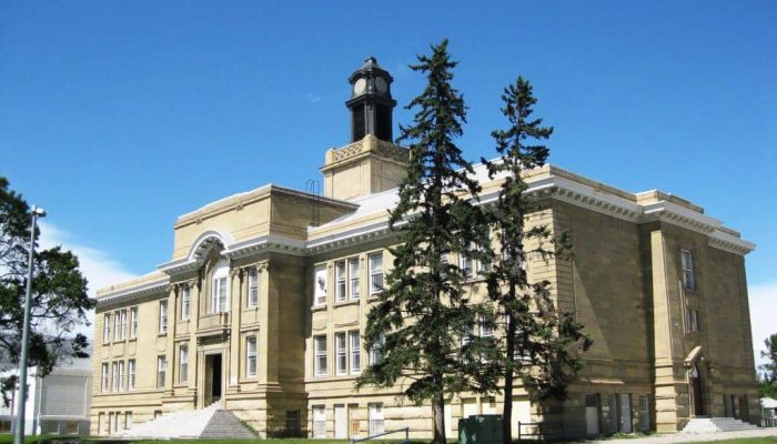 Balmoral school pic a large stone statue in front of a building