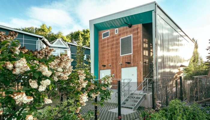 sunnyside lift station a house with a fence in front of a building