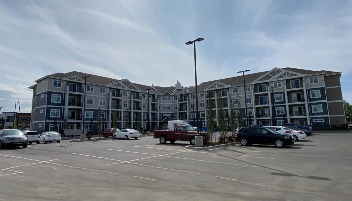 Aspera a car parked on a city street