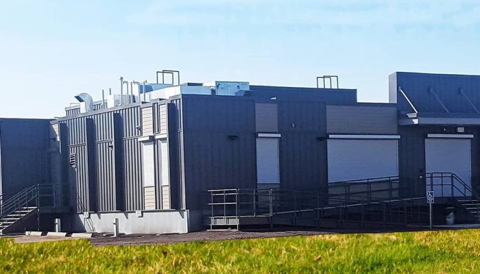 Red-Earth-Creek Courthouse a building next to a fence