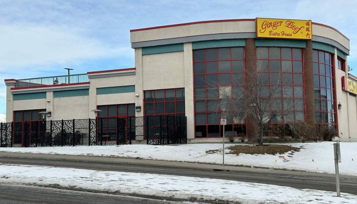 Commercial Center 22nd St. NE a building covered in snow